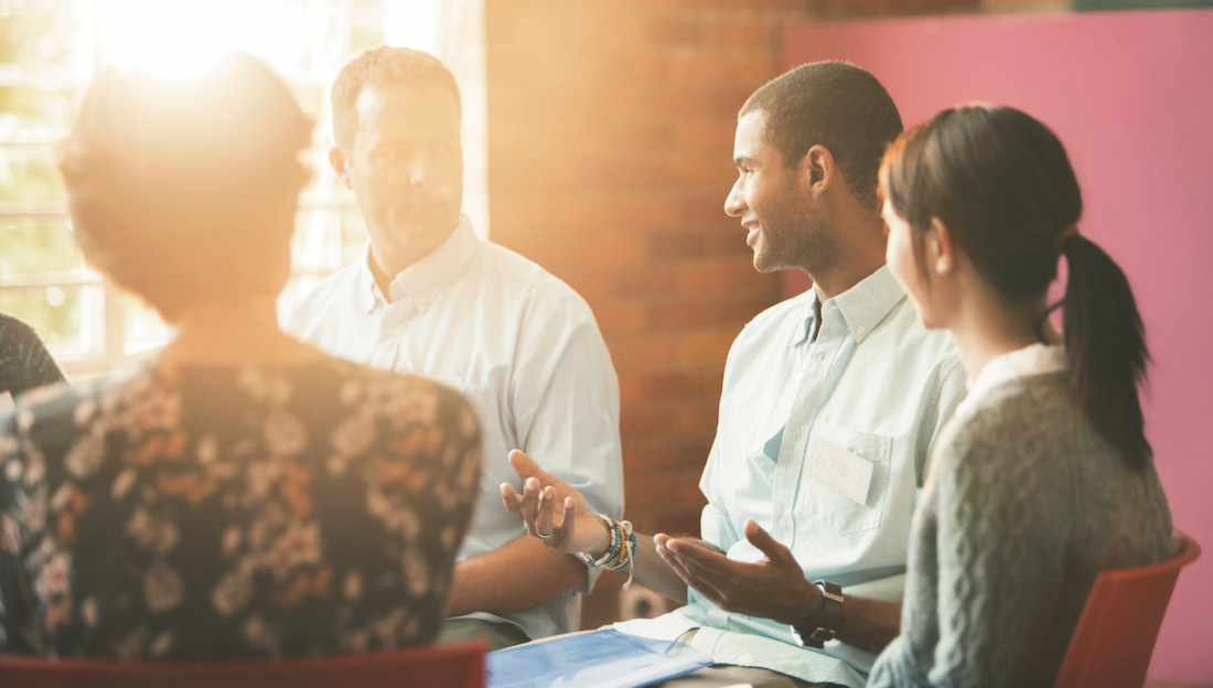 Man talking in group therapy session